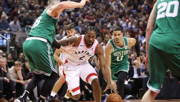 Oct 19, 2018; Toronto, Ontario, CAN; Toronto Raptors forward Kawhi Leonard (2) dribbles to the basket against Boston Celtics forward Jayson Tatum (0) at Scotiabank Arena. Mandatory Credit: Tom Szczerbowski-USA TODAY Sports