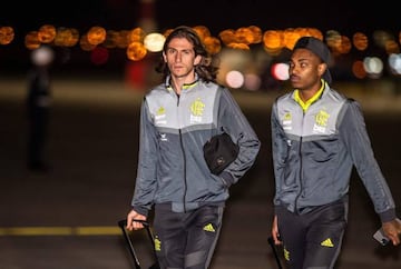 Brazil's Flamengo Filipe Luis (L) arrives with teammates at the airport in Lima on November 20, 2019, ahead of the Copa Libertadores final football match against Argentina's River Plate to be held there on November 23.