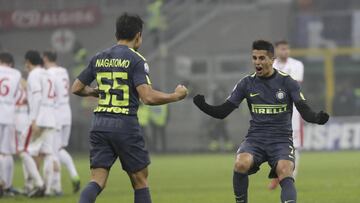 Inter Milan&#039;s Yuto Nagatomo, left, celebrates with his teammate Joao Cancelo after scoring the decisive penalty during the Italian Cup soccer match between Inter Milan and Pordenone at the San Siro stadium in Milan, Italy, Tuesday, Dec.12, 2017. Inter won 5-4 following a shootout. (AP Photo/Luca Bruno)