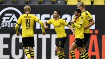 DORTMUND, GERMANY - MAY 16: Raphael Guerreiro of Borussia Dortmund (C) celebrates with team mate Julian Brandt (L) after scoring his side's second goal during the Bundesliga match between Borussia Dortmund and FC Schalke 04 at Signal Iduna Park on Ma
