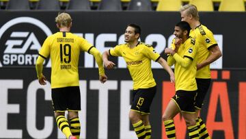 DORTMUND, GERMANY - MAY 16: Raphael Guerreiro of Borussia Dortmund (C) celebrates with team mate Julian Brandt (L) after scoring his side&#039;s second goal during the Bundesliga match between Borussia Dortmund and FC Schalke 04 at Signal Iduna Park on Ma