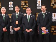 Mexico's head coach Javier Aguirre (L), Mexican Football League President Mikel Arriola (2-R) and other members of the Mexican delegation pose on the red carpet upon arrival to attend the draw for the 2026 FIFA Football World Cup taking place in the US, Canada and Mexico, at the Kennedy Center, in Washington, DC, on December 5, 2025. (Photo by Roberto SCHMIDT / AFP)