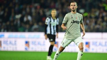 Juventus' Bosnian midfielder Miralem Pjanic eyes the ball during the Italian Serie A football match between Udinese Calcio and Juventus at the Dacia Arena Stadium in Udine on October 6, 2018. (Photo by Miguel MEDINA / AFP)