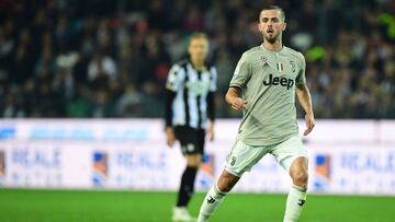 Juventus&#039; Bosnian midfielder Miralem Pjanic eyes the ball during the Italian Serie A football match between Udinese Calcio and Juventus at the Dacia Arena Stadium in Udine on October 6, 2018. (Photo by Miguel MEDINA / AFP)