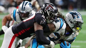 ATLANTA, GEORGIA - OCTOBER 30: D'Onta Foreman #33 of the Carolina Panthers is tackled by Arnold Ebiketie #47 of the Atlanta Falcons during the fourth quarter at Mercedes-Benz Stadium on October 30, 2022 in Atlanta, Georgia. (Photo by Kevin C. Cox/Getty Images)