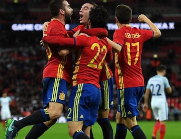 Spain's players celebrate Isco's stoppage-time equaliser.