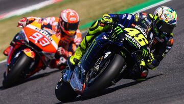 Monster Energy Yamaha Italian rider, Valentino Rossi (R) and Repsol Honda Team Spanish rider, Marc Marquez steer their motorbikes during the Q2 qualifying session ahead of the San Marino MotoGP Grand Prix race at the Misano World Circuit Marco Simoncelli