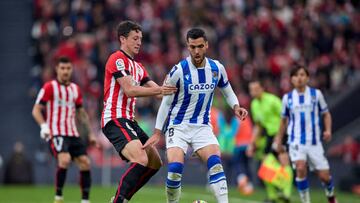 BILBAO, SPAIN - APRIL 16: Mikel Vesga of Athletic Club compete for the ball with Mikel Merino of Real Sociedad during the LaLiga Santander match between Athletic Club and Real Sociedad at San Mames Stadium on April 16, 2023 in Bilbao, Spain. (Photo by Ion Alcoba/Quality Sport Images/Getty Images)