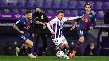 VALLADOLID, SPAIN - JANUARY 29: Javi Galán of Huesca tackles Fabián Orellana of Real Valladolid during the La Liga Santander match between Real Valladolid CF and SD Huesca at Estadio Municipal Jose Zorrilla on January 29, 2021 in Valladolid, Spain. Sporti