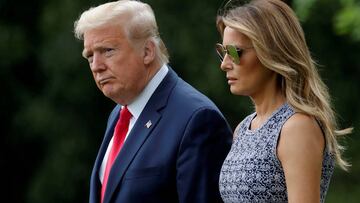 FILE PHOTO - U.S. President Donald Trump and first lady Melania Trump walk to the Marine One helicopter to depart for travel to the Kennedy Space Center in Florida from the South Lawn of the White House in Washington, U.S., May 27, 2020. REUTERS/Carlos Ba