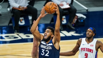 Dec 23, 2020; Minneapolis, Minnesota, USA; Minnesota Timberwolves center Karl-Anthony Towns (32) shoots during the fourth quarter against the Detroit Pistons at Target Center. Mandatory Credit: Brace Hemmelgarn-USA TODAY Sports