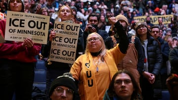 Demonstrators hold signs and gesture, as they take part in a rally on the day of a general strike to protest U.S. President Donald Trump's deployment of thousands of immigration enforcement officers, at the Target Center in Minneapolis, Minnesota, U.S., January 23, 2026. REUTERS/Evelyn Hockstein