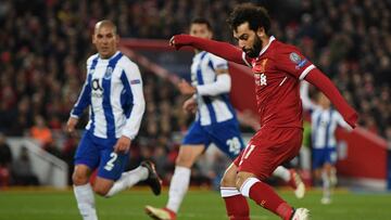LIVERPOOL, ENGLAND - MARCH 06: Mohamed Salah of Liverpool shoots during the UEFA Champions League Round of 16 Second Leg match between Liverpool and FC Porto at Anfield on March 6, 2018 in Liverpool, United Kingdom. (Photo by Shaun Botterill/Getty Image