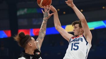 Basketball - FIBA World Cup 2023 - First Round - Group C - United States of America v New Zealand - Mall of Asia Arena, Manila, Philippines - August 26, 2023 Austin Reaves of the U.S. in action with New Zealand's Isaac Fotu REUTERS/Lisa Marie David