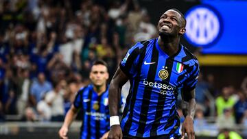 Inter Milan's French forward #09 Marcus Thuram celebrates after scoring his team third goal during the Italian Serie A football match between Inter Milan and Atalanta at San Siro Stadium in Milan, Italy on August 30, 2024. (Photo by Piero CRUCIATTI / AFP)