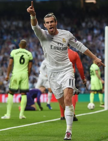 Gareth Bale wheels away after beating Joe Hart, with his strike eventually credited as a Fernando own goal.