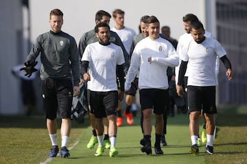 Juventus' goalkeeper Neto, Daniel Alves, Paulo Dybala and Tomas Rincon take part in a training session on the eve of the UEFA Champions League game against FC Porto.