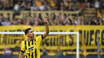 Dortmund's English midfielder Jude Bellingham celebrates with Dortmund's supporters after the German first division Bundesliga football match between Borussia Dortmund and VfL Wolfsburg in Dortmund, western Germany on May 7, 2023. (Photo by INA FASSBENDER / AFP) / DFL REGULATIONS PROHIBIT ANY USE OF PHOTOGRAPHS AS IMAGE SEQUENCES AND/OR QUASI-VIDEO