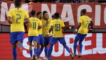 Brazil forward Roberto Firmino, center, is congratulated by teammates after scoring a goal against the United States during the first half of an international soccer friendly match, Friday, Sept. 7, 2018, in East Rutherford, N.J. (AP Photo/Julio Cortez)