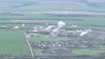 Explosions are seen in a village during a military strike in a location given as near Izium, Ukraine in this screen grab obtained from a social media video released April 30, 2022. Courtesy of National Guard Of Ukraine/via REUTERS THIS IMAGE HAS BEEN SUPPLIED BY A THIRD PARTY. MANDATORY CREDIT.