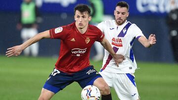 PAMPLONA, SPAIN - FEBRUARY 07: Edu Exposito of SD Eibar battles for possession with Ante Budimir of C.A. Osasuna during the La Liga Santander match between C.A. Osasuna and SD Eibar at Estadio El Sadar on February 07, 2021 in Pamplona, Spain. Sporting sta