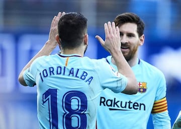 Alba of FC Barcelona celebrates with his teammates Lionel Messi of FC Barcelona after scoring his team's second goal during the La Liga match between SD Eibar and FC Barcelona at Ipurua