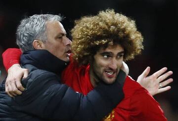 United's Marouane Fellaini celebrates scoring with manager Jose Mourinho.