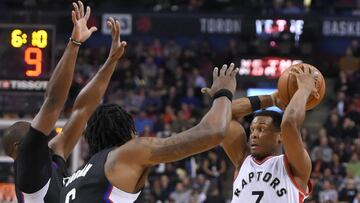 Feb 6, 2017; Toronto, Ontario, CAN; Toronto Raptors guard Kyle Lowry (7) looks to pass the ball as Los Angeles Clippers center DeAndre Jordan (6) and guard Raymond Felton (2) defend in the second half at Air Canada Centre. Mandatory Credit: Dan Hamilton-USA TODAY Sports