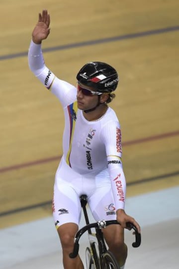 Colombia's Fernando Gaviria Rendon celebrates after he won the Men's Omnium, at the end of the Men's Omnium Points Race at the UCI Track Cycling World Championships in Saint-Quentin-en-Yvelines, near Paris, on February 21, 2015.   AFP PHOTO / ERIC FEFERBERG