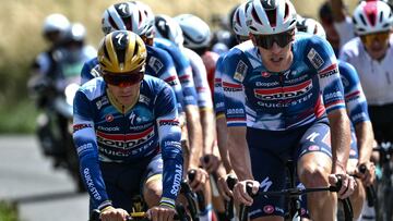 Soudal Quick-Step team's Belgian rider Remco Evenepoel, and Soudal Quick-Step team's Dutch rider Pascal Eenkhoorn cycle in a training session on the eve of the start of the 112th edition of the Tour de France cycling race, near Arras, close to Lille, northern France, on July 4, 2025. (Photo by Marco BERTORELLO / AFP)