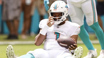 MIAMI GARDENS, FLORIDA - SEPTEMBER 19: Tua Tagovailoa #1 of the Miami Dolphins reacts after being sacked against the Buffalo Bills during the first quarter at Hard Rock Stadium on September 19, 2021 in Miami Gardens, Florida.   Michael Reaves/Getty Images