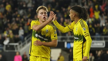 Apr 6, 2024; Columbus, Ohio, USA; Columbus Crew midfielder Aidan Morris (8) celebrates a goal with defender Mohamed Farsi (23) in the second half against D.C. United at Lower.com Field. Mandatory Credit: Trevor Ruszkowski-USA TODAY Sports