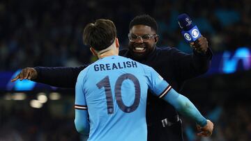 Soccer Football - Champions League - Semi Final - Second Leg - Manchester City v Real Madrid - Etihad Stadium, Manchester, Britain - May 17, 2023 Manchester City's Jack Grealish celebrates with TV pundit Micah Richards after the match REUTERS/Molly Darlington