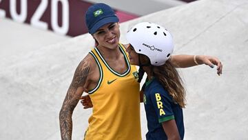 Brazil&#039;s Leticia Bufoni (L) and Brazil&#039;s Rayssa Leal embrace each other after competing in the women&#039;s street preliminary round during the Tokyo 2020 Olympic Games at Ariake Sports Park Skateboarding in Tokyo on July 26, 2021. (Photo by Jef