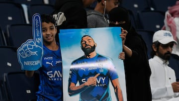 Soccer Football - Saudi Pro League - Al Hilal v Al Ettifaq - Kingdom Arena, Riyadh, Saudi Arabia - February 13, 2026 A Al Hilal fan holds up a poster of Karim Benzema in the stands before the match REUTERS/Stringer