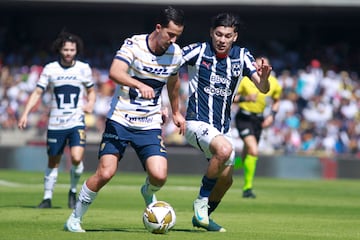 Pumas' defender #02 Pablo Bennevendo (L) and Monterrey's defender #03 Gerardo Arteaga fight for the ball during the Liga MX Apertura tournament quarterfinal second leg football match between Pumas and Monterrey at the Olimpico Universitario stadium in Mexico City on December 1, 2024. (Photo by Victor Cruz / AFP)