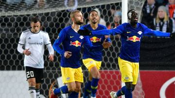 Leipzig's French forward Jean-Kevin Augustin (R) celebrates scoring the opening goal with his teammates during the UEFA Europa League Group B football match Rosenborg BK v RB Leipzig in Rosenborg, Norway on October 4, 2018. (Photo by Ole Martin Wold
