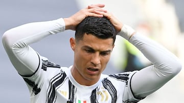 Juventus' Portuguese forward Cristiano Ronaldo reacts during the Italian Serie A football match Juventus vs Inter on May 15, 2021 at the Juventus stadium in Turin. (Photo by Isabella BONOTTO / AFP)