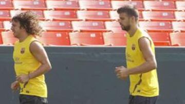 Piqué y Puyol se entrenan con normalidad y podrían estar contra el Mallorca