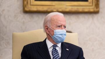 US President Joe Biden speaks before a meeting about the American Jobs Plan in the Oval Office of the White House April 19, 2021, in Washington, DC. (Photo by Brendan Smialowski / AFP)