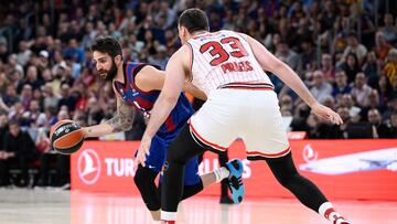 Barcelona's Spanish guard #09 Ricky Rubio vies with Olympiacos Piraeus' Greek guard #33 Nikola Milutinov (R) during the Euroleague quarter-final second fifth basketball match between FC Barcelona and Olympiakos Piraeus at the Palau Blaugrana arena in Barcelona on May 8, 2024. (Photo by Josep LAGO / AFP)