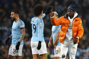 Mendy celebrates with match-winner Leroy Sané after Manchester City's 2-1 victory over Liverpool.