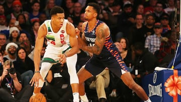Dec 25, 2018; New York, NY, USA; Milwaukee Bucks forward Giannis Antetokounmpo (34) dribbles the ball while being defended by New York Knicks forward Lance Thomas (42) during the first half at Madison Square Garden. Mandatory Credit: Andy Marlin-USA TODAY Sports