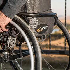 Why is Greg Abbott, the governor of Texas, in a wheelchair and what happened to him?