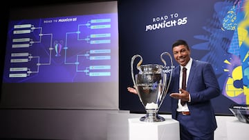 Soccer Football - Champions League - Round of 16, Quarter-Final, Semi-Final and Final draws - UEFA Headquarters, Nyon, Switzerland - February 21, 2025 Former Brazil footballer Giovane Elber poses with the Champions League trophy after the completed draw REUTERS/Pierre Albouy