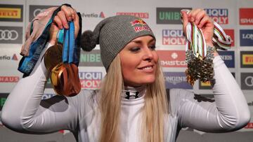 Alpine Skiing - FIS Alpine World Ski Championships - Women's Downhill - Are, Sweden - February 10, 2019 - Bronze medalist Lindsey Vonn of the U.S. poses with medals during a news conference. REUTERS/Denis Balibouse