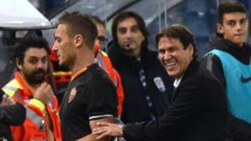 Totti, con el actual entrenador Rudi García.