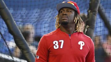 FILE - In this April 12, 2019, file photo, Philadelphia Phillies center fielder Odubel Herrera gets ready for the team&#039;s baseball game against the Miami Marlins in Miami. Herrera has accepted a suspension for the rest of the season under Major League Baseball&acirc;s domestic violence policy. The commissioner&acirc;s office announced the decision Friday, July 5, two days after domestic assault charges against him in Atlantic City, N.J., were dismissed. He had been charged with simple assault and knowingly causing bodily injury stemming from an incident on May 27 at the Golden Nugget Casino. The woman, his girlfriend, declined to press charges. (AP Photo/Brynn Anderson, File)
