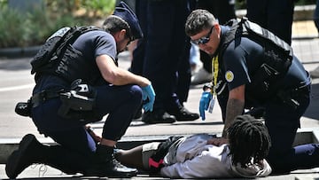 One police officer was stabbed in the chest at the Tour de France by a man the authorities had been pursuing.