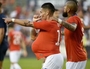 Chile defender Óscar Opazo, left, celebrates his goal during the first half of an international friendly soccer match against the United States, Tuesday, March 26, 2019, in Houston. (AP Photo/Eric Christian Smith)